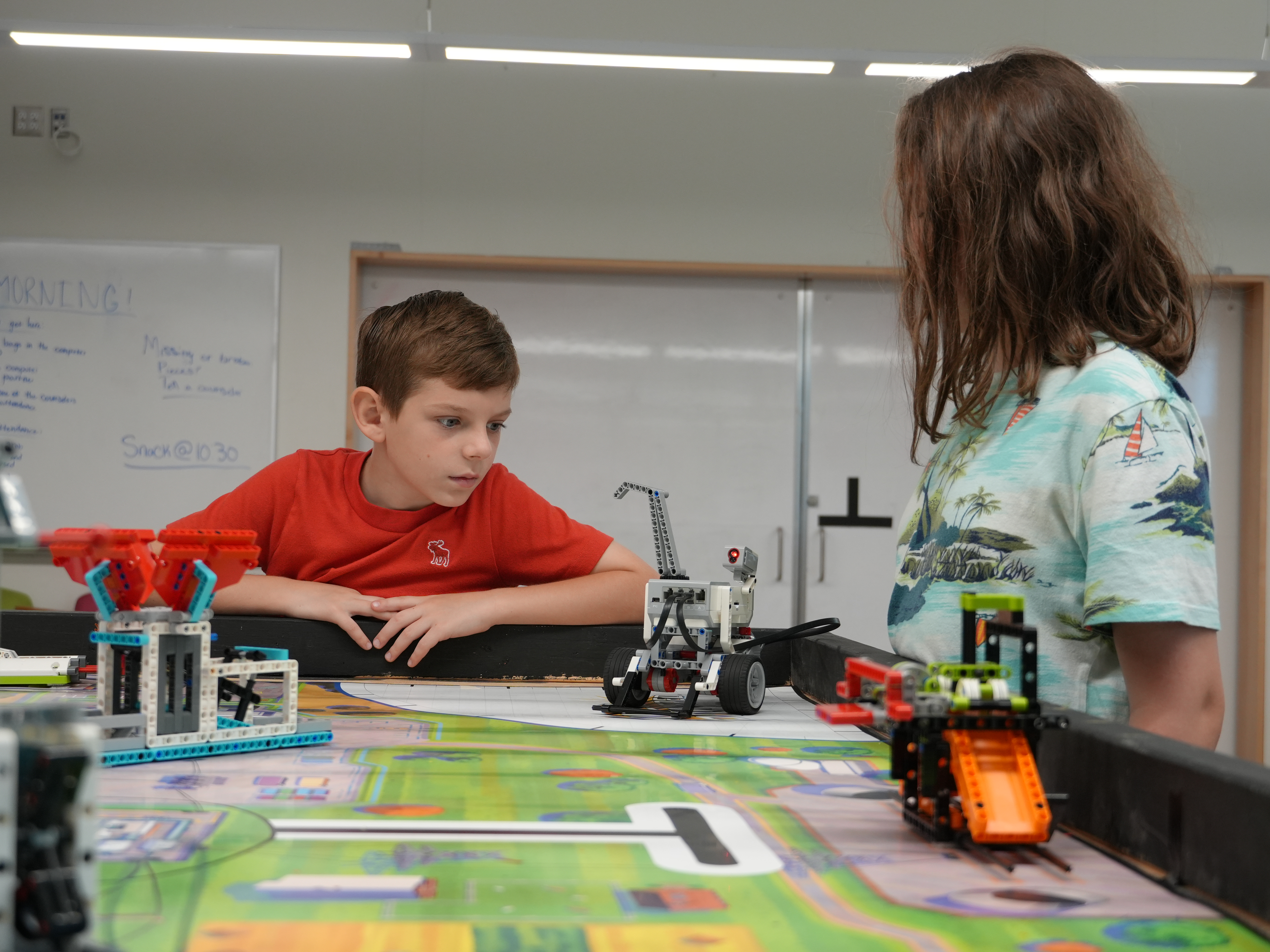 Students of our FLL summer camp testing their robots on a field