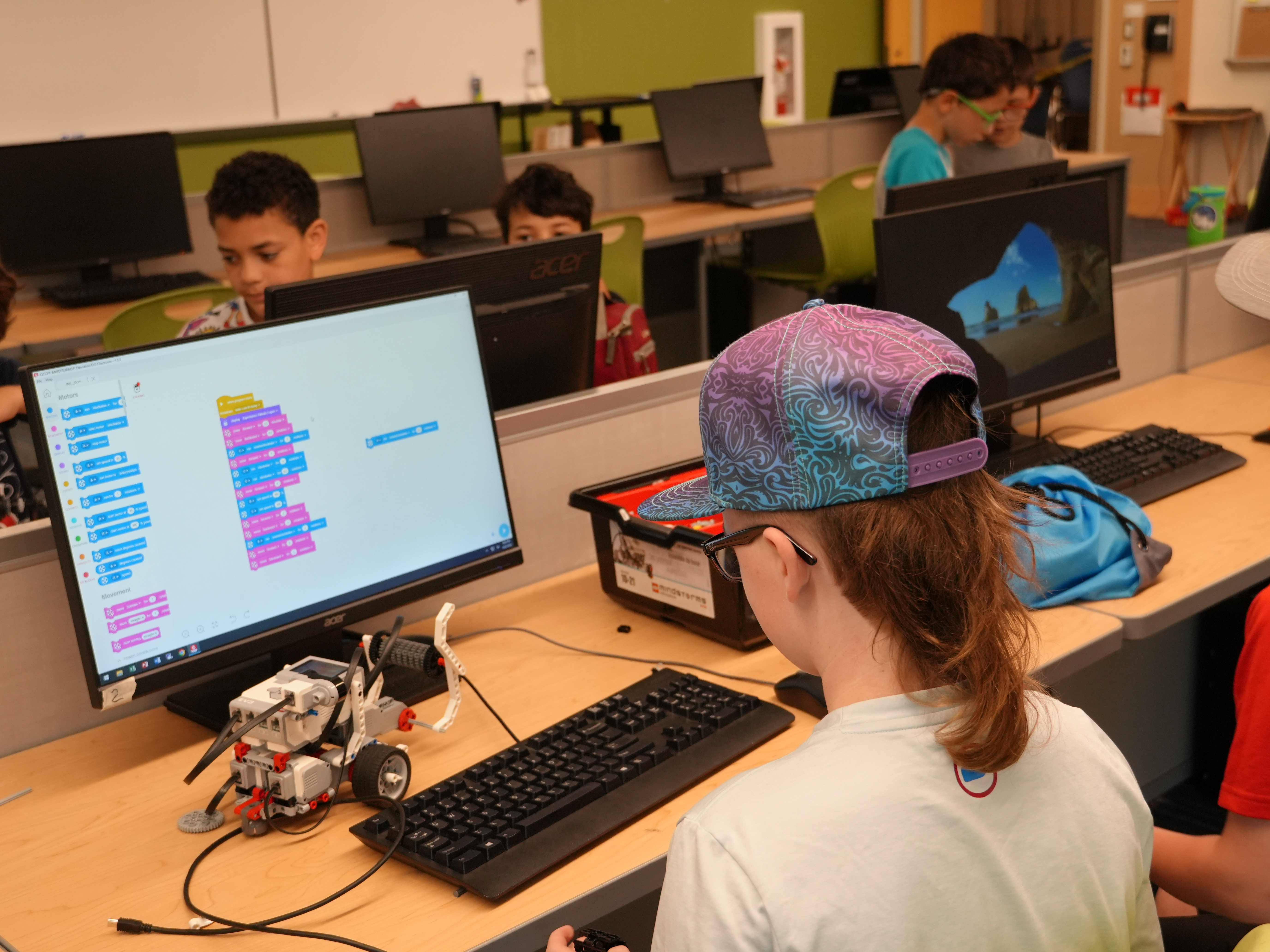 Students of our FLL summer camp working on their robots
